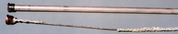 An anode in use for seven years is compared to a new one