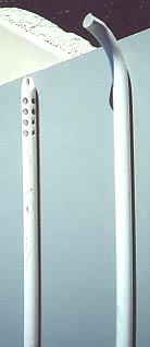 A curved dip tube lies next to one with a closed end